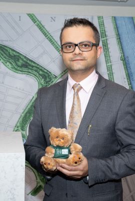 A Man Holding A Teddy Bear